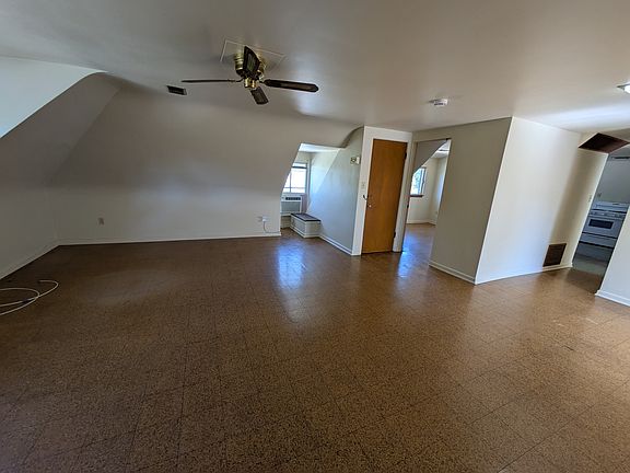 Living room (bedroom 2 and kitchen in background)
