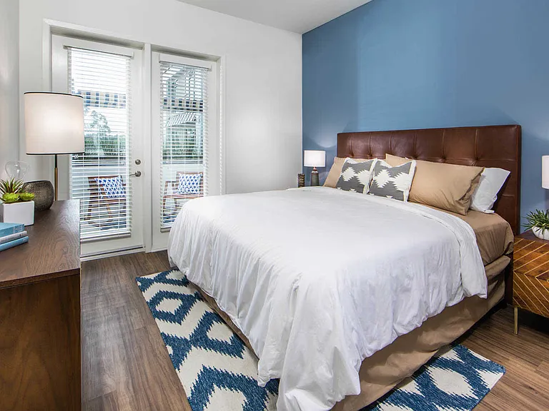 Bedroom with Balcony and Hard Surface Flooring