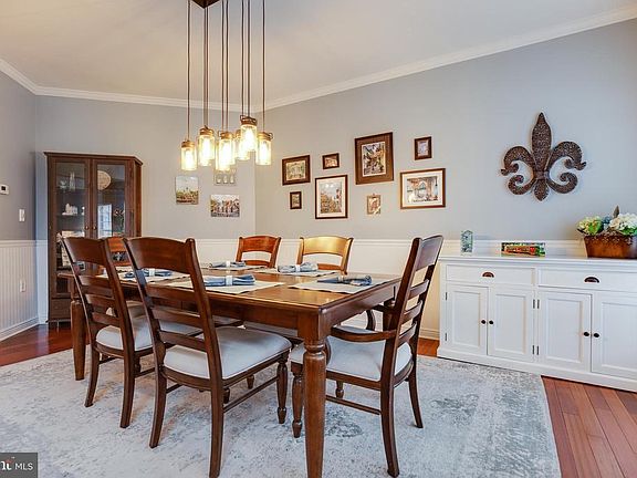 Dining room with Upgraded Lighting/Custom Moldings