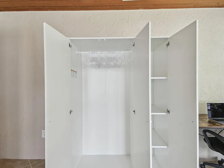 Armoire for hanging clothes and storage
