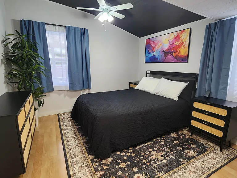 This is the primary bedroom in the back past the kitchen. Queen size zero gravity massage bed.
