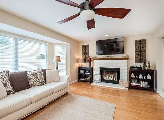 The great room boast gleaming hardwood floors.