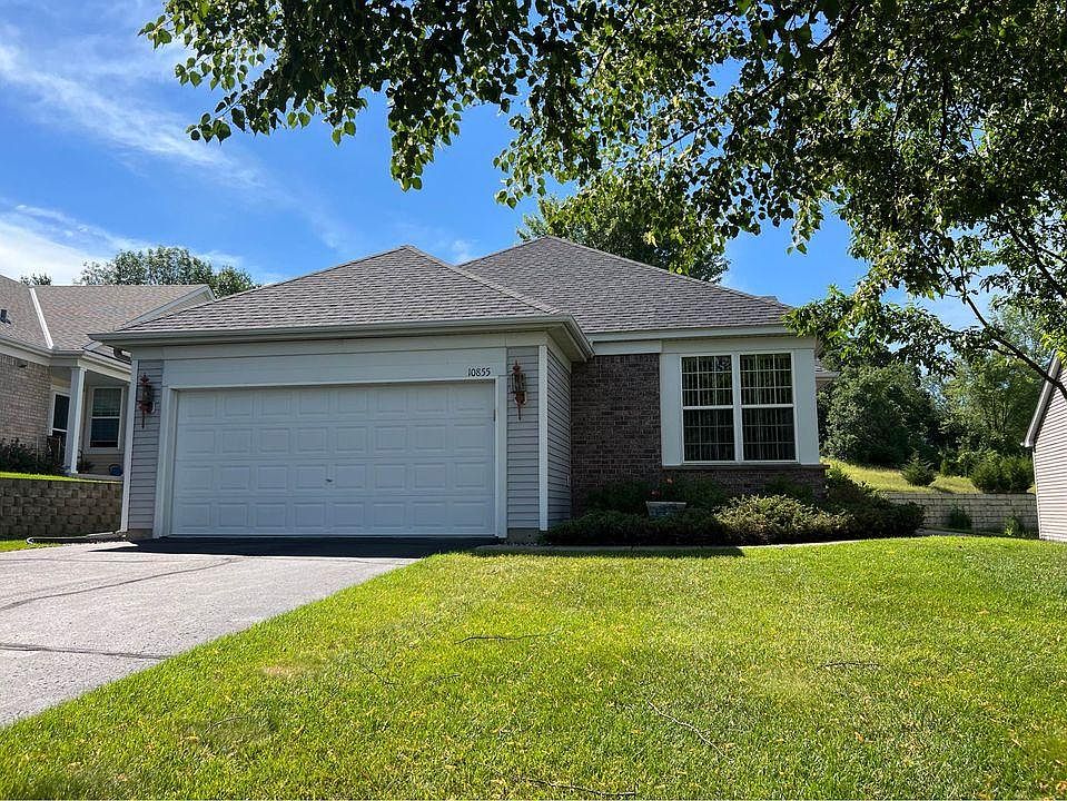 Front exterior with 2-car garage.