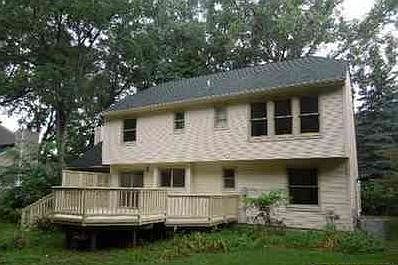 Large backyard and deck. Direct access to community walking/