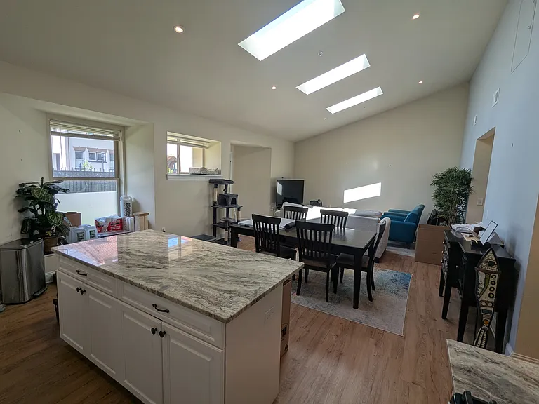 Kitchen to Living Room with Skylights