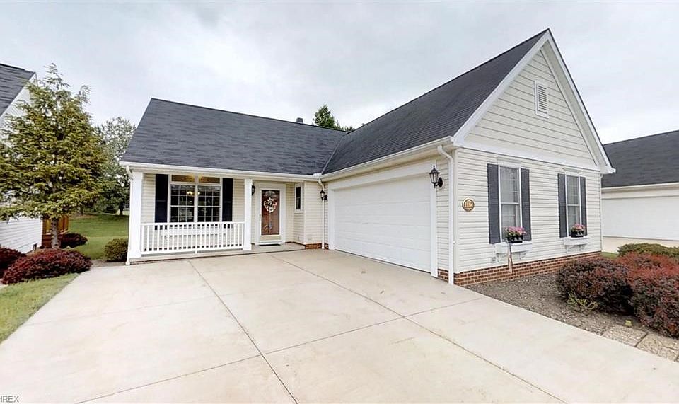 Great curb appeal! Front porch with room for seating, window boxes & turn in 2 car garage!