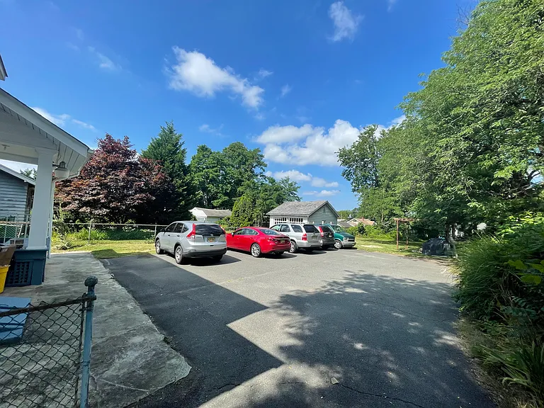 Ashphalt Parking in the back of the house. Upto 3 dedicated parking spaces.