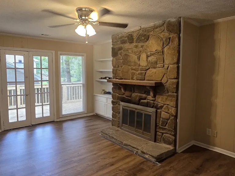 Keeping/Dining Room with Stacked Stone Gas Fireplace