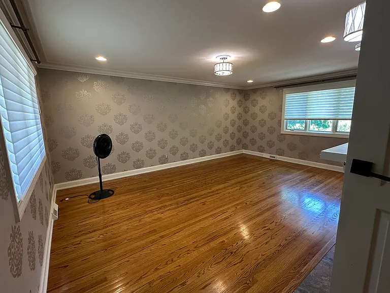 Bedroom 1 on second floor, with walk-in closet and featuring the third fireplace.