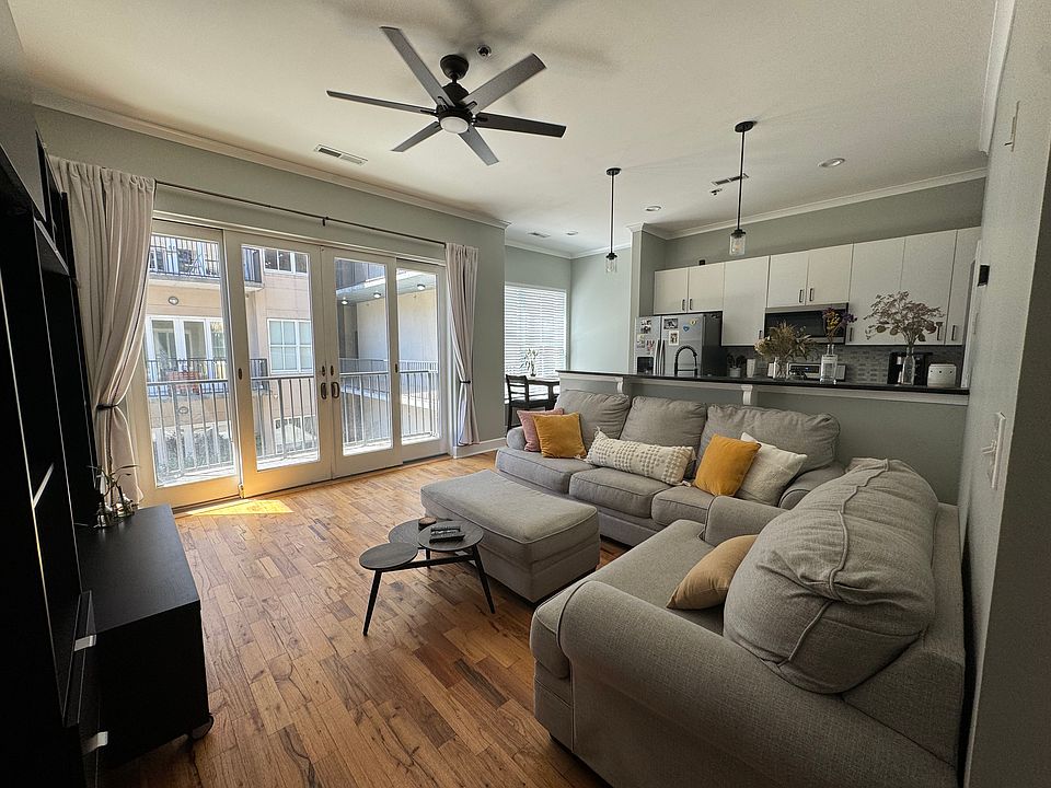 Living Room. Patio and windows facing courtyard.