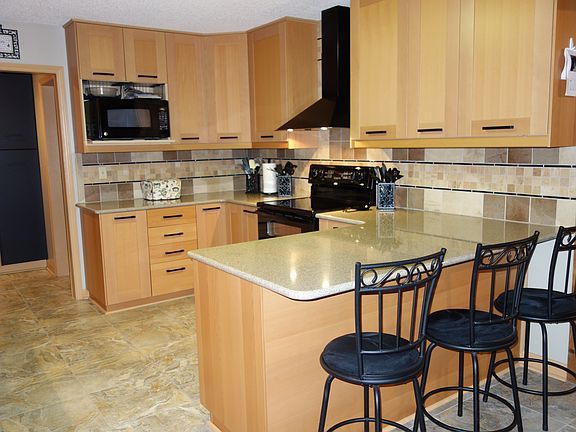 Kitchen has tile floor