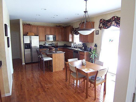 Beautiful kitchen features maple cabinets