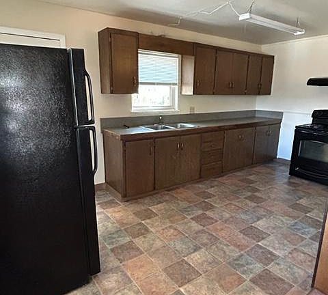 Simple but functional, large kitchen.