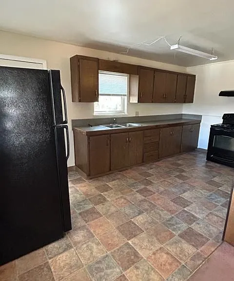 Simple but functional, large kitchen.
