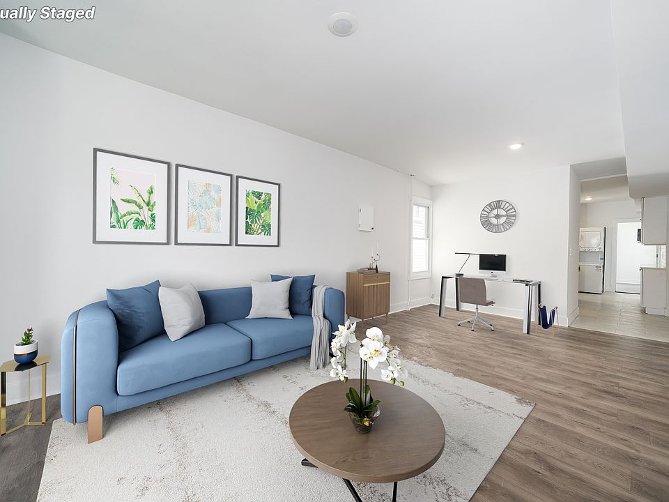 Spacious living room with ample space for dining and work areas