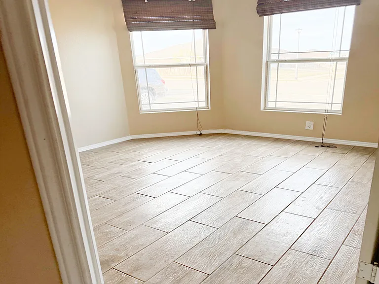 Lovely, nice size bedroom #2 with brand new ceramic wood tile flooring.