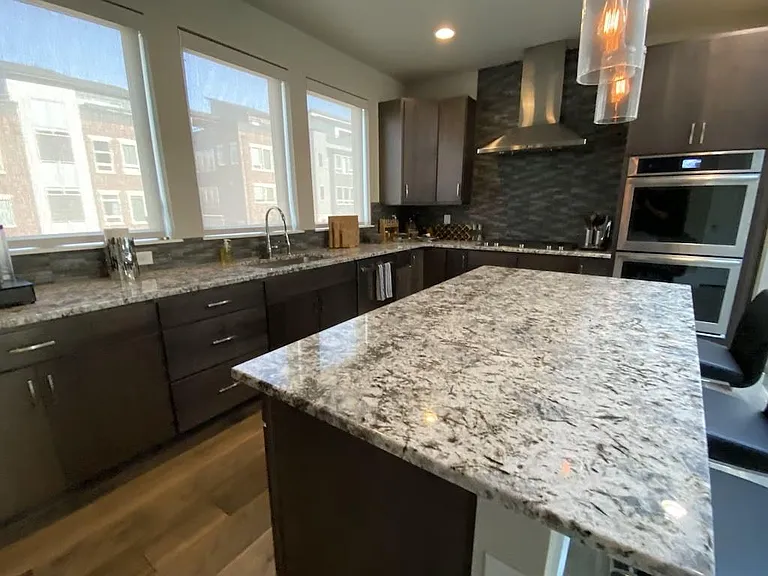 Double ovens, microwave, massive Jenn-Air refrigerator, chef's knives, Caphalon cookware.