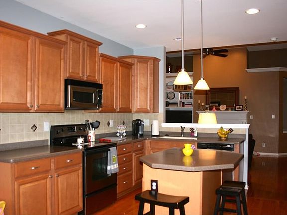 Kitchen back splash, solid surface counter tops, stainless steel appliances, and upgraded staggered cabinets.