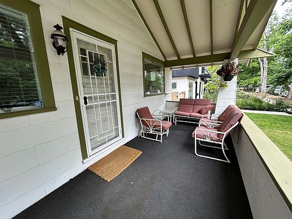 Front porch - steps up from the side. Nice porch for sitting and good for deliveries