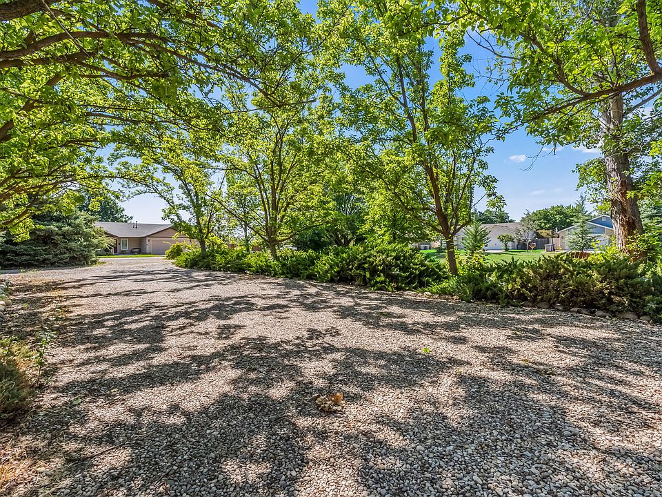 Back of House. Covered and shaded parking. Park-like setting.