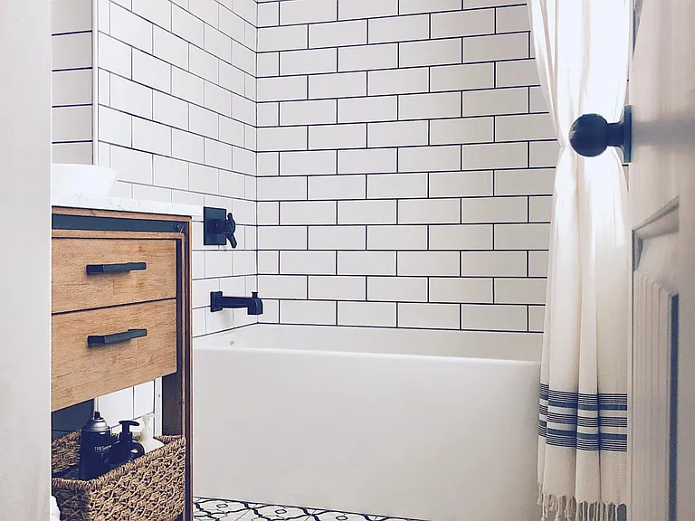 Primary bathroom with custom tile, large soaking tub and bidet