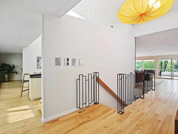Entry foyer opening into kitchen and living room