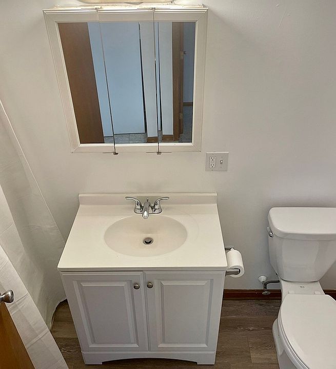 Bathroom with tub/shower combo and large storage closet.