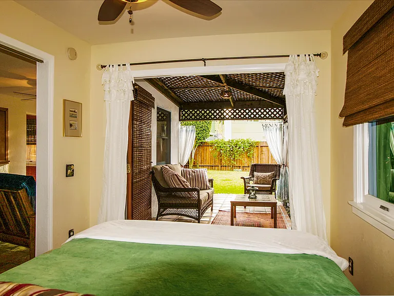 Bedroom opens out into cabana room and yard through double french doors