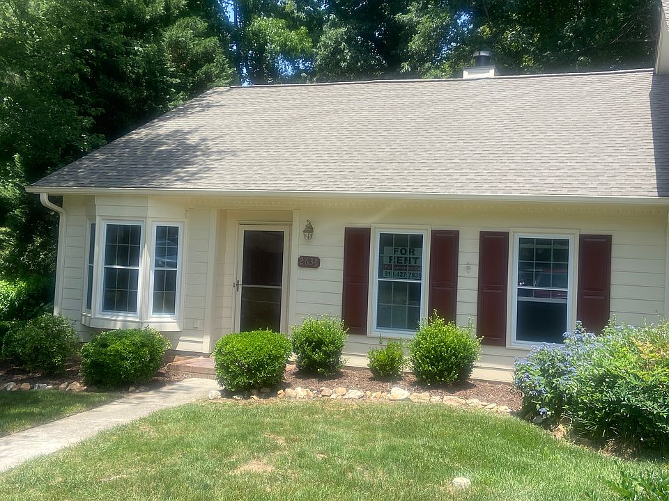 Front of home with 2 dedicated parking spots at the ned of the walk.