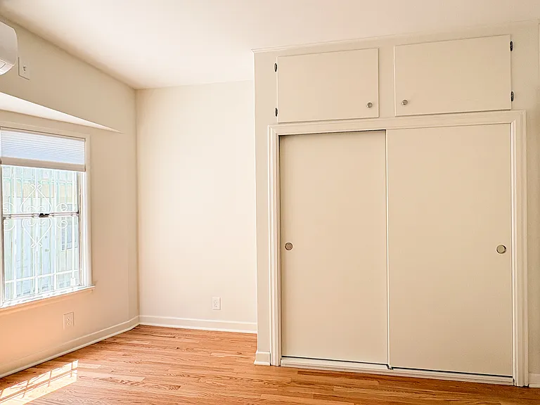 Second bedroom with large closet and cabinets
