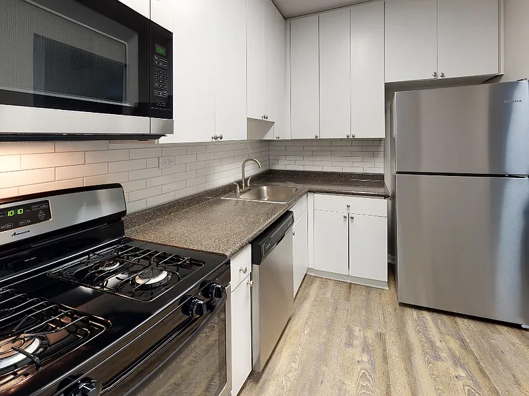 Subway tile backsplash, stainless steel appliances, and ample storage