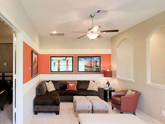 A spacious bonus room on the second floor can serve as a game room, as shown here. An optional adjoi