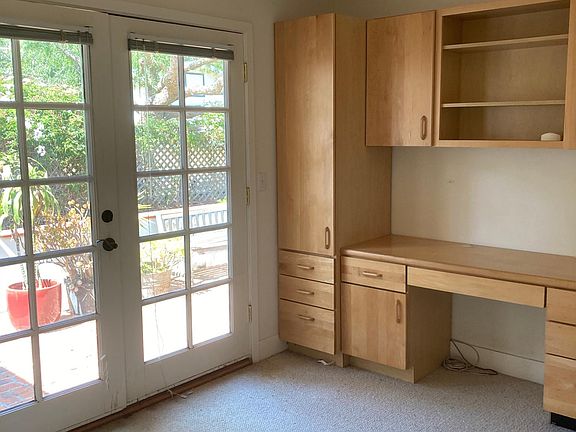 one bedroom w/built-in desk and french doors