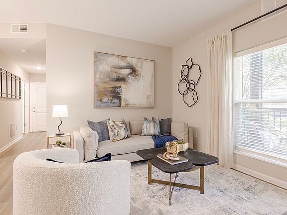 Newly Renovated Living Room with Hardwood-Style Flooring