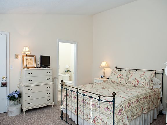 Bedroom with skylight-lit bath