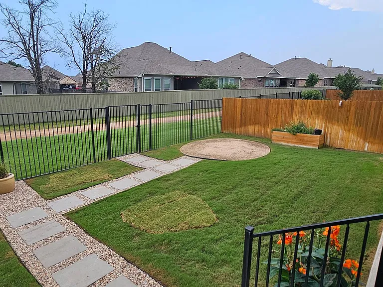 Spacious backyard with access to one of the many hike/bike trails located in the community.