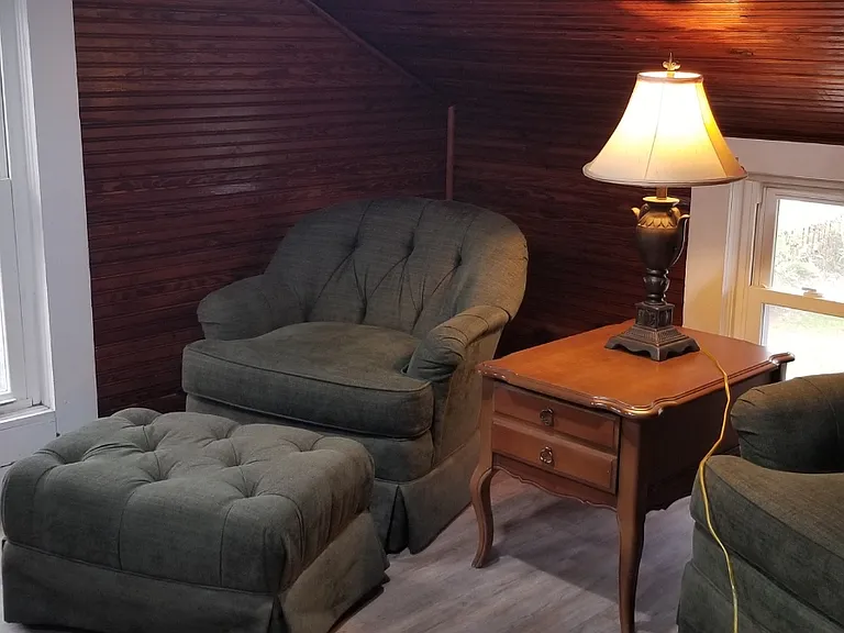 Sitting room with TV & bay view