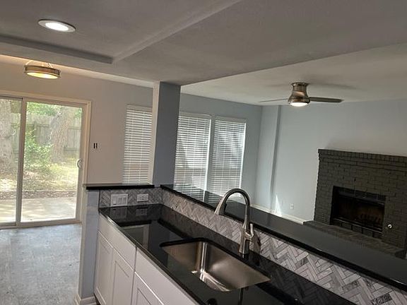 Kitchen view into Dining and Living Room