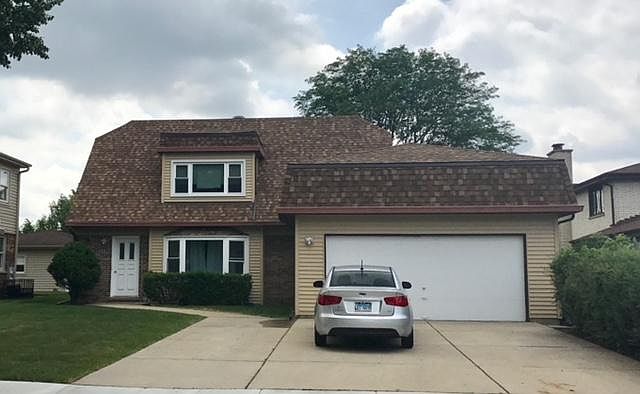 Shared Oversized Driveway for tenant parking & 2 car garage shared with 1st floor family tenants