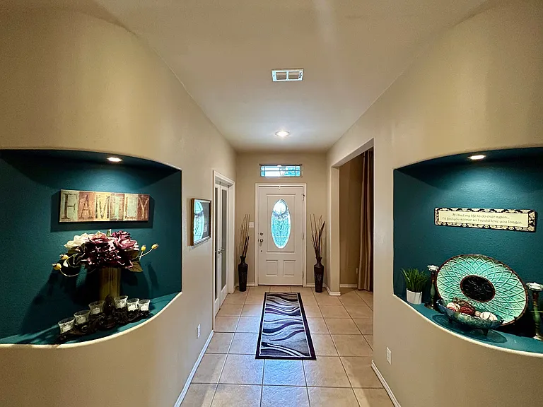 Built ins with downlighting provide elegant ambiance