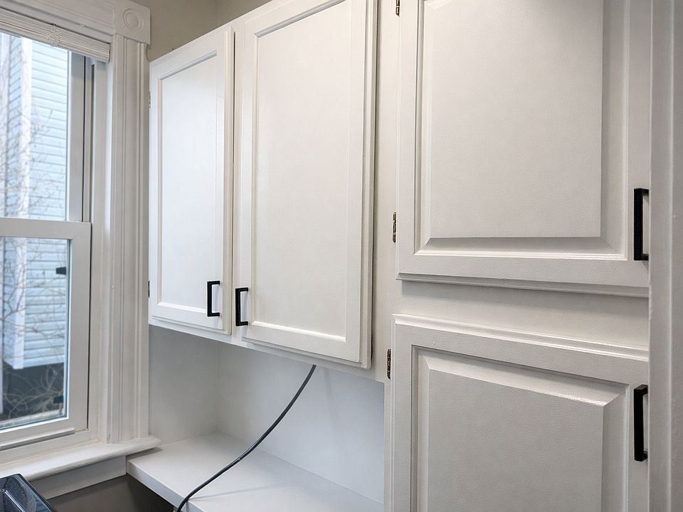 Walk in pantry with washer.