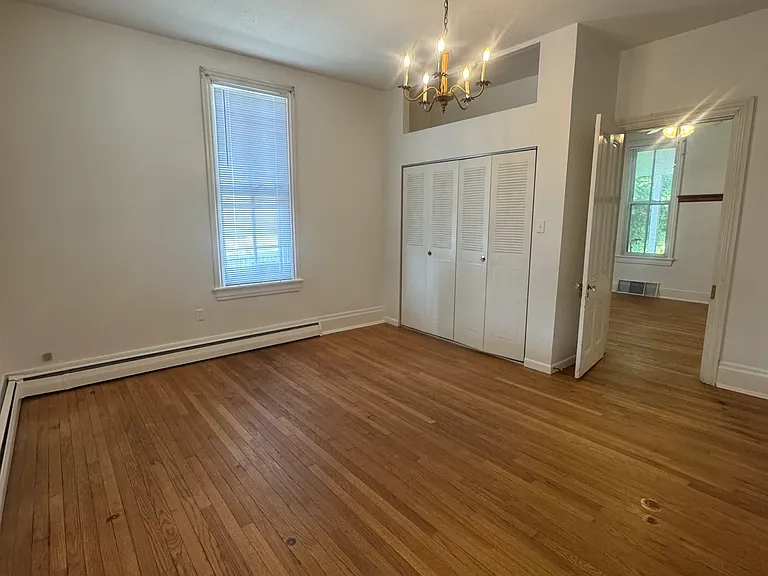 bedroom w/spacious closet and storage above