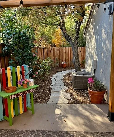 Travertine pathway to back patio