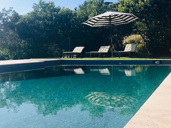 Heated pool, full privacy. Travertine deck. Pebbled pool finish on the interior of the pool.
