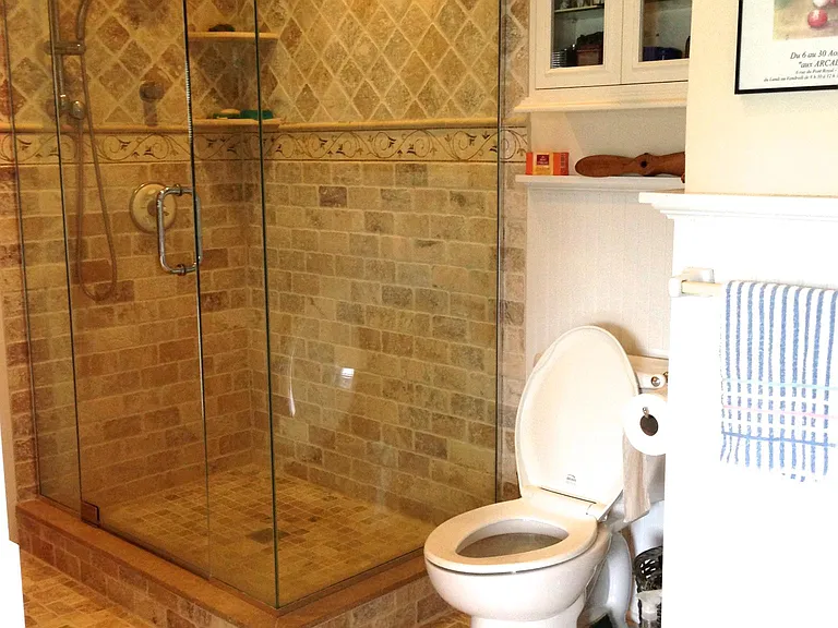 second bath travertine tile and glass shower