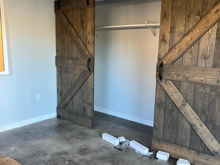 large closet with farmer doors