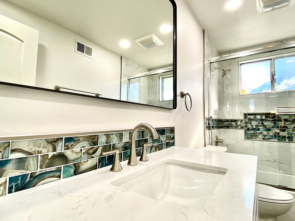 Full Bathroom - Everything is brand new, brand new vanity with granite countertops, sink, faucets, upgraded expansive mirror, toilet, tub/shower, custom glass tile vanity backsplash with matching accents into the shower.