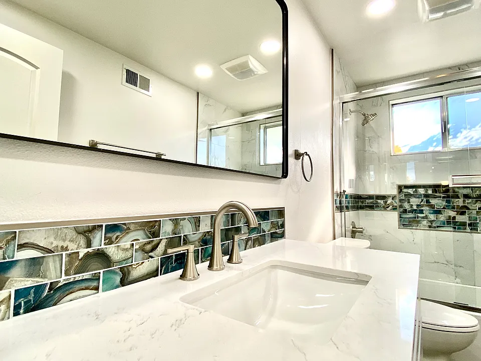 Full Bathroom - Everything is brand new, brand new vanity with granite countertops, sink, faucets, upgraded expansive mirror, toilet, tub/shower, custom glass tile vanity backsplash with matching accents into the shower.