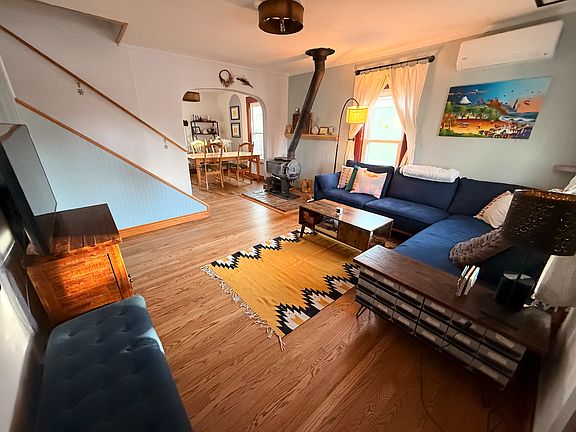 from front door: living room. Working wood burning stove and new mini split