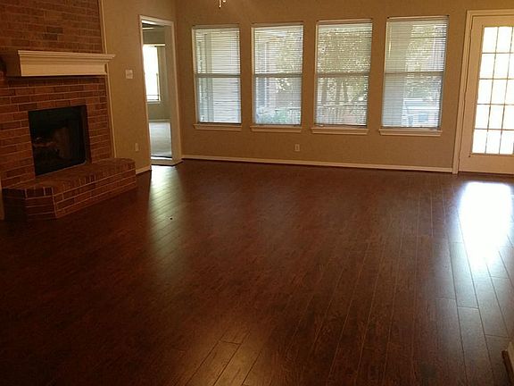 Your view as you open the door! Updates include: fresh paint, wood floors, lights & ceiling fans. A wall of windows overlooks the back yard.